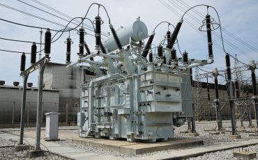 Large electrical transformer at an outdoor power substation.